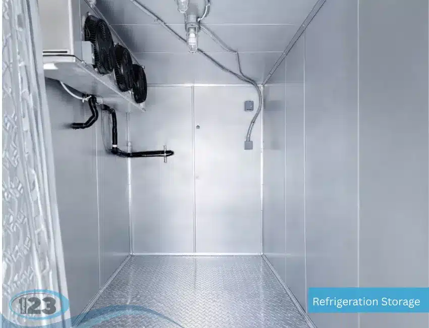 Empty refrigerated trailer interior with cooling unit and metal floor