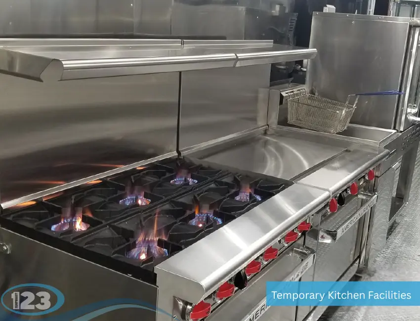 Professional mobile kitchen trailer equipped with multi-burner gas stove, griddle, fryer, and commercial ventilation for large-scale food service.