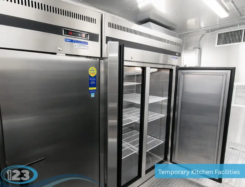 Commercial walk-in refrigerator and freezer inside a portable kitchen trailer for safe food storage during temporary kitchen operations.