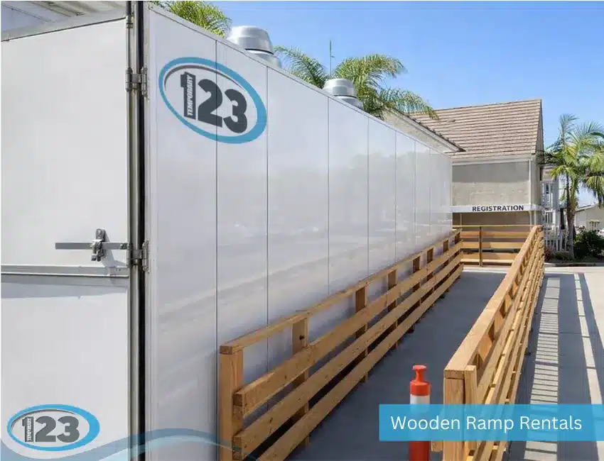 Exterior view of a temporary commercial kitchen trailer installed with a wooden access ramp for safe entry during long-term temporary operations.