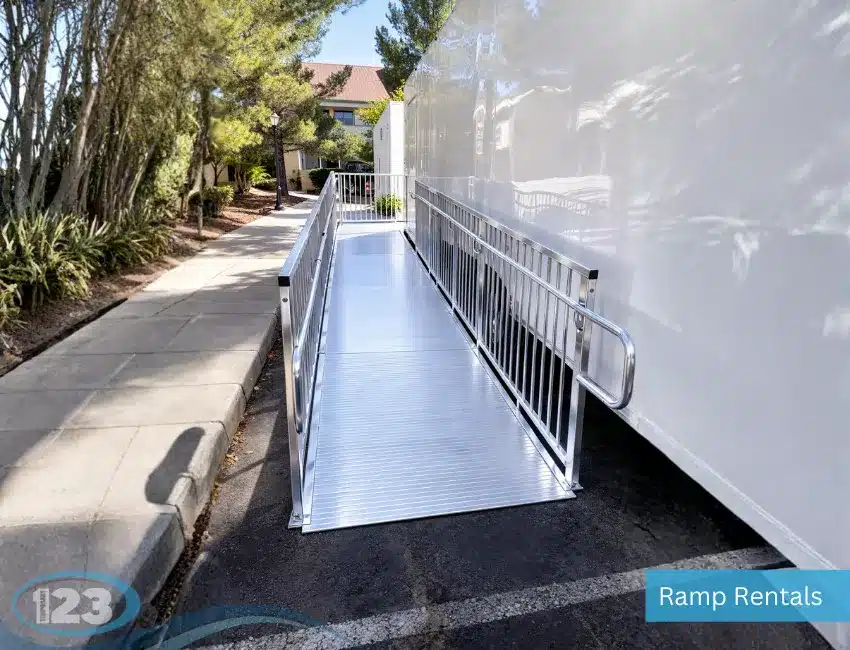 Aluminum wheelchair-accessible ramp installed at a portable kitchen trailer to provide safe ADA-compliant access for staff and visitors.